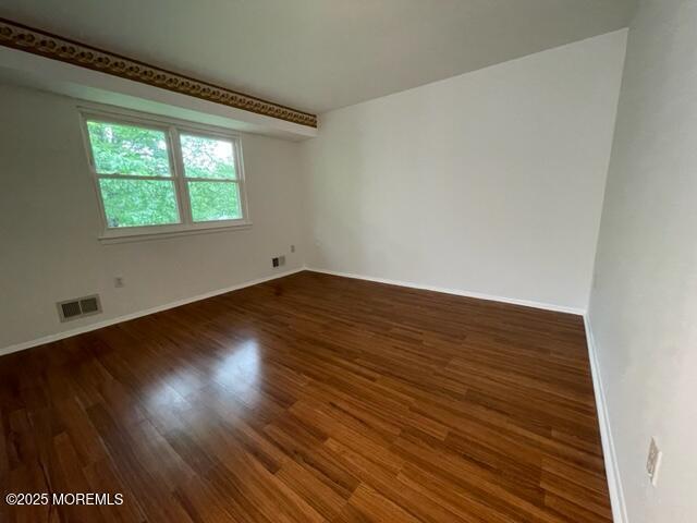8 Indiana Ct Unit 1016, Matawan, NJ 07747 - spare room with wood finished floors and baseboards