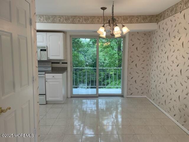 8 Indiana Ct Unit 1016, Matawan, NJ 07747 - unfurnished dining area with light tile patterned floors, a chandelier, wallpapered walls, and baseboards