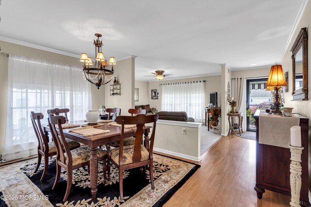 28 Mansfield Ave, Manchester, NJ 08759 - dining area featuring a chandelier, ornamental molding, light wood finished floors, baseboards, and ceiling fan