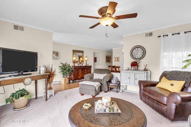 28 Mansfield Ave, Manchester, NJ 08759 - living area featuring crown molding, a ceiling fan, and carpet flooring