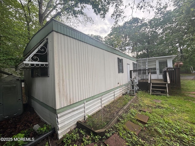 65 Lincoln St, Howell, NJ 07731 - view of side of home with a deck and central AC