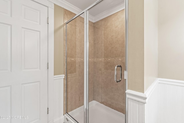 183 Crestview Dr, Middletown, NJ 07748 - bathroom with ornamental molding, a shower stall, a decorative wall, and a wainscoted wall