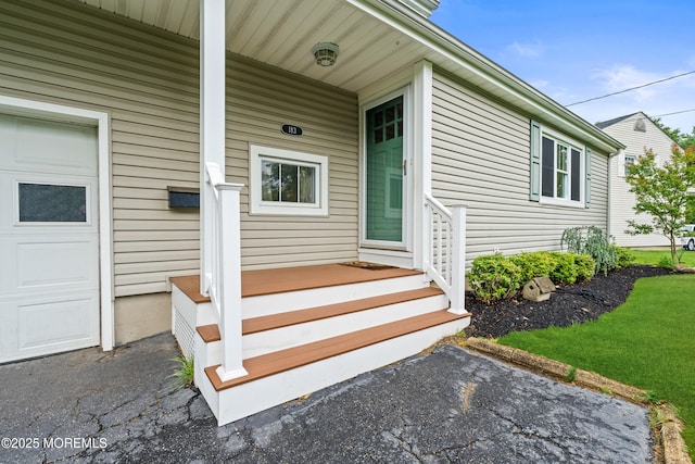 183 Crestview Dr, Middletown, NJ 07748 - view of exterior entry featuring a garage