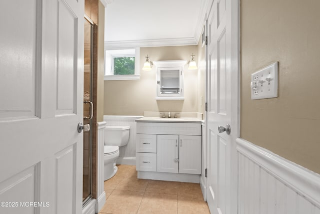 183 Crestview Dr, Middletown, NJ 07748 - bathroom with vanity, a wainscoted wall, toilet, tile patterned floors, and a shower with door