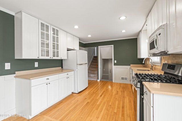 183 Crestview Dr, Middletown, NJ 07748 - kitchen with white appliances, a sink, ornamental molding, white cabinetry, and recessed lighting