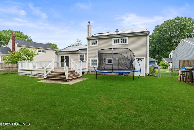 183 Crestview Dr, Middletown, NJ 07748 - rear view of property with a deck and a chimney