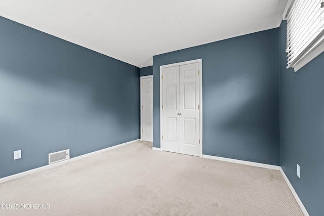 183 Crestview Dr, Middletown, NJ 07748 - unfurnished bedroom with baseboards, a closet, and carpet flooring