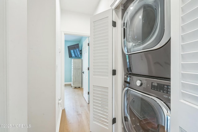 8 W St, Rumson, NJ 07760 - laundry area featuring stacked washer / drying machine, wood finished floors, and baseboards