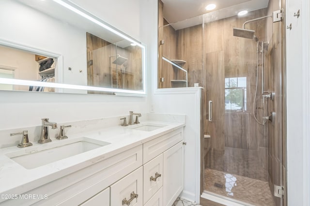 8 W St, Rumson, NJ 07760 - full bathroom featuring a shower stall, double vanity, and recessed lighting