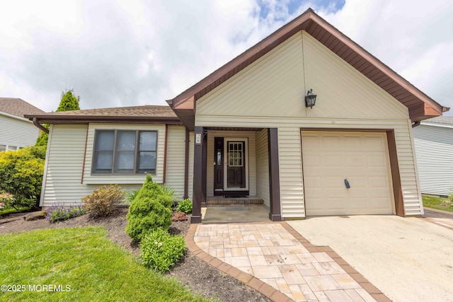 28 Fir Rd Unit 21, Manahawkin, NJ 08050 - view of front of home with a garage and driveway