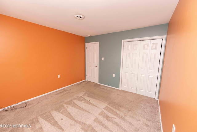 28 Fir Rd Unit 21, Manahawkin, NJ 08050 - unfurnished bedroom with carpet, a closet, and baseboards