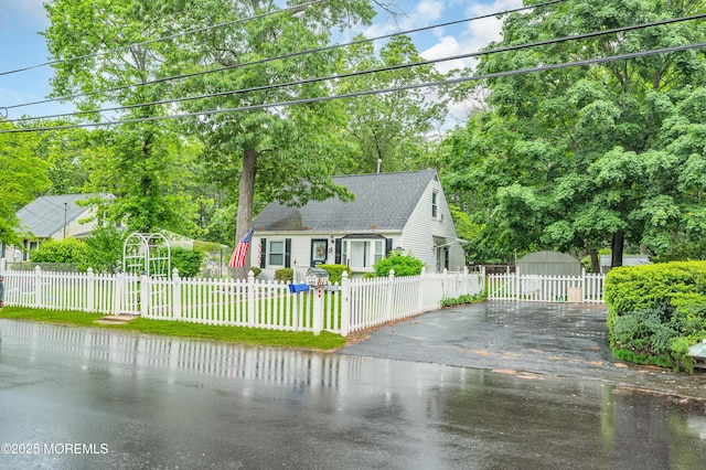 443 Shady Ln, Howell, NJ 07731 - cape cod house with roof with shingles, view of scattered trees, and a water view