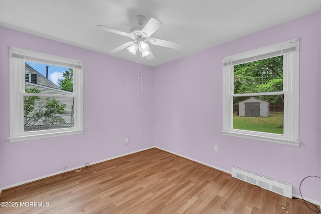 443 Shady Ln, Howell, NJ 07731 - unfurnished room with light wood finished floors, baseboards, and ceiling fan