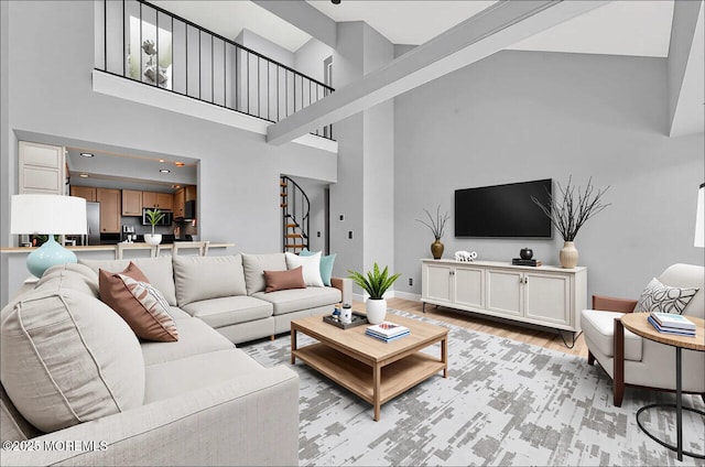 3623 Royce Ct, Hillsborough, NJ 08844 - living area featuring high vaulted ceiling, light wood-type flooring, stairs, and baseboards