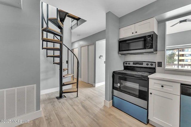 3623 Royce Ct, Hillsborough, NJ 08844 - kitchen featuring stainless steel appliances, white cabinetry, baseboards, decorative backsplash, and light wood finished floors