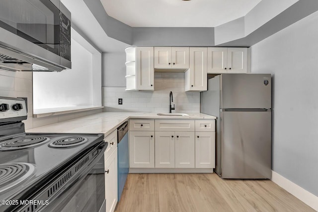 3623 Royce Ct, Hillsborough, NJ 08844 - kitchen with stainless steel appliances, a sink, white cabinetry, light stone countertops, and light wood-type flooring