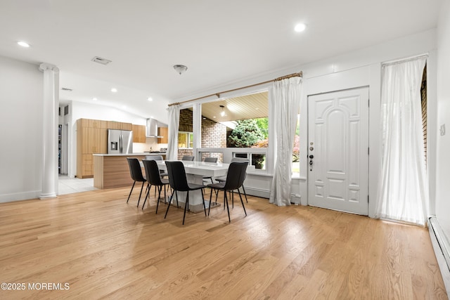 606 Deal Rd, Oakhurst, NJ 07755 - dining room with a baseboard heating unit, recessed lighting, light wood-type flooring, lofted ceiling, and ornate columns