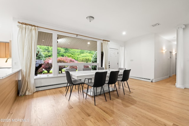 606 Deal Rd, Oakhurst, NJ 07755 - dining space with baseboard heating, decorative columns, light wood-style flooring, and recessed lighting