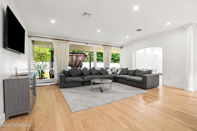 606 Deal Rd, Oakhurst, NJ 07755 - living area featuring arched walkways, light wood finished floors, healthy amount of natural light, recessed lighting, and ornate columns