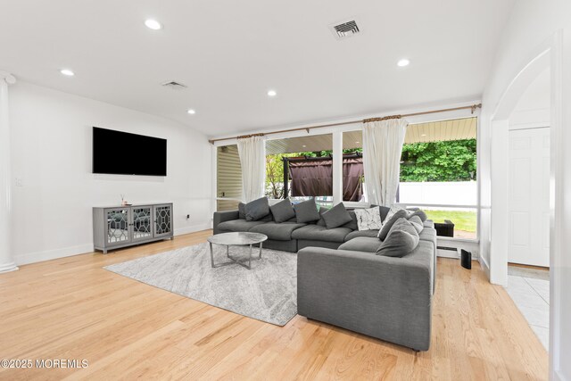606 Deal Rd, Oakhurst, NJ 07755 - living room featuring light wood-style flooring, recessed lighting, and a baseboard radiator