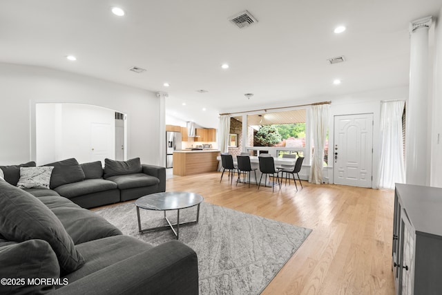 606 Deal Rd, Oakhurst, NJ 07755 - living room with light wood-type flooring, recessed lighting, and arched walkways