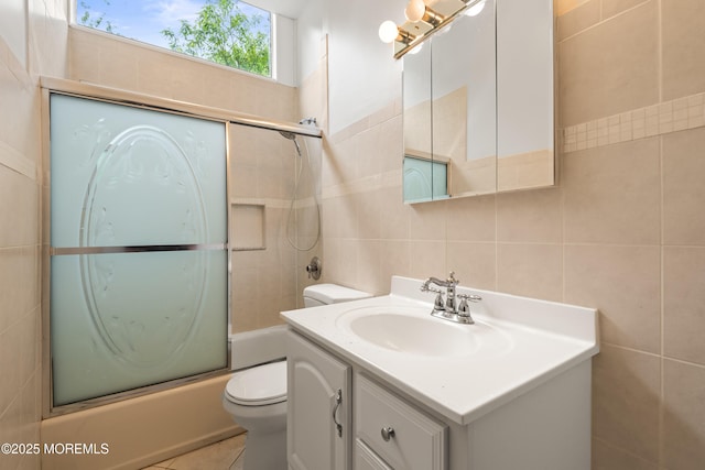 606 Deal Rd, Oakhurst, NJ 07755 - bathroom featuring tile walls, bath / shower combo with glass door, vanity, and decorative backsplash