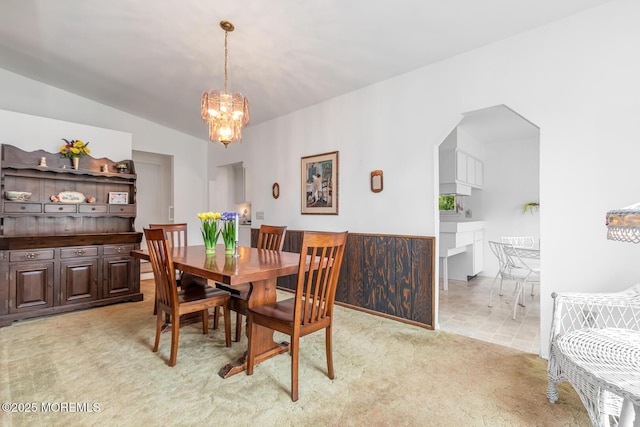 4 Mason Dr, Hazlet, NJ 07730 - dining space with light carpet, a chandelier, lofted ceiling, and arched walkways