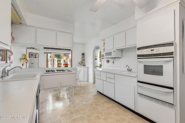 4 Mason Dr, Hazlet, NJ 07730 - kitchen featuring white appliances, a warming drawer, a sink, light countertops, and white cabinets