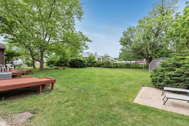 4 Mason Dr, Hazlet, NJ 07730 - view of green lawn featuring a deck, central AC, and a patio area