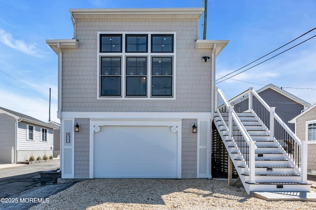 123 W Cove Way, Lavallette, NJ 08735 - view of front of house featuring stairs, a garage, and gravel driveway