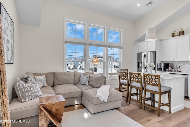 123 W Cove Way, Lavallette, NJ 08735 - living room featuring a high ceiling, light wood-type flooring, and recessed lighting