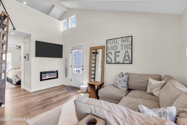 123 W Cove Way, Lavallette, NJ 08735 - living area with wood finished floors, beam ceiling, high vaulted ceiling, a glass covered fireplace, and baseboards