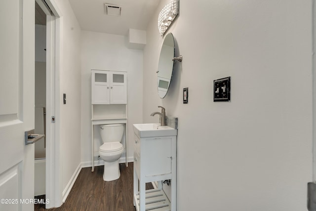 717 Zlotkin Cir Unit 1, Freehold, NJ 07728 - bathroom with vanity, wood finished floors, toilet, and baseboards