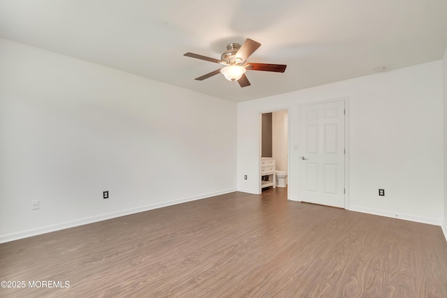 717 Zlotkin Cir Unit 1, Freehold, NJ 07728 - unfurnished room with ceiling fan, dark wood-type flooring, and baseboards