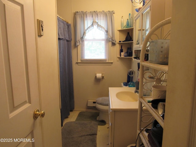 138 N Cooks Bridge Rd, Jackson, NJ 08527 - bathroom featuring a baseboard heating unit, vanity, toilet, a shower with shower curtain, and tile patterned floors
