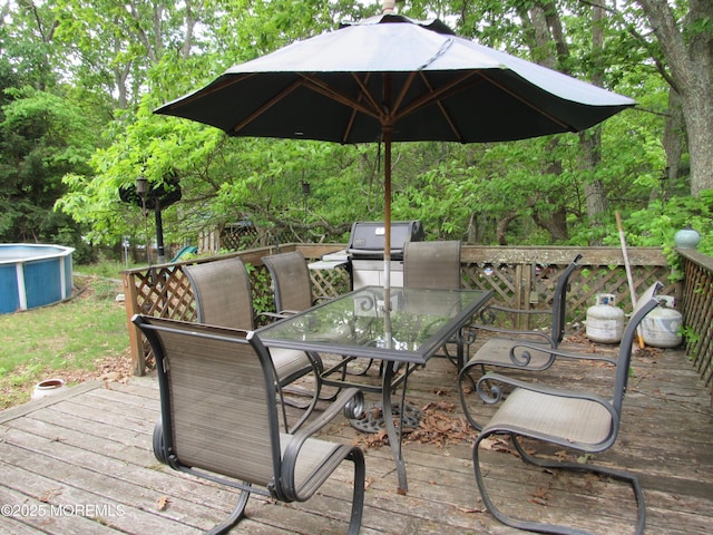 138 N Cooks Bridge Rd, Jackson, NJ 08527 - wooden terrace with outdoor dining area, an outdoor pool, and a grill
