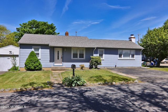 68 Elm St, Beachwood, NJ 08722 - ranch-style house with a chimney, a front lawn, and a shingled roof