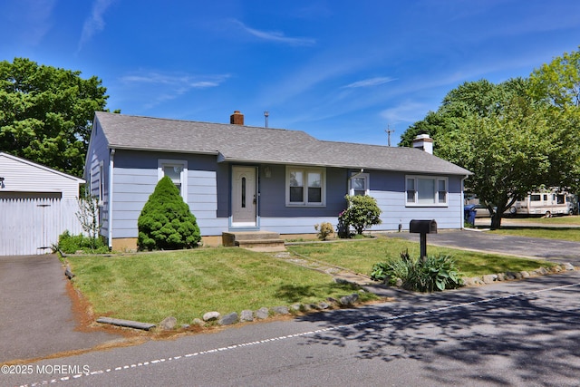 68 Elm St, Beachwood, NJ 08722 - ranch-style house featuring a chimney, a front yard, and a shingled roof