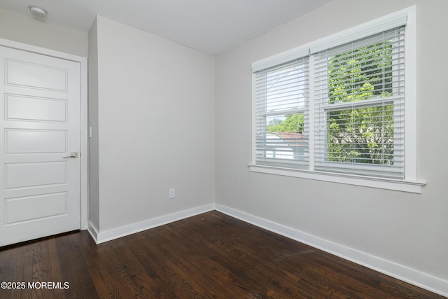 68 Elm St, Beachwood, NJ 08722 - spare room featuring baseboards, a smoke detector, and dark wood-type flooring