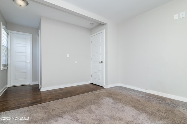 68 Elm St, Beachwood, NJ 08722 - empty room featuring dark carpet, baseboards, and dark wood-style floors