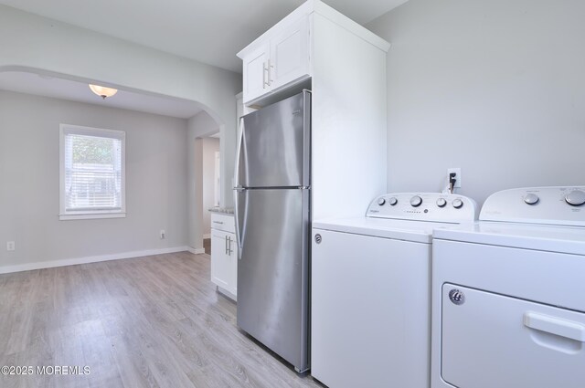 68 Elm St, Beachwood, NJ 08722 - washroom with arched walkways, light wood finished floors, separate washer and dryer, and baseboards