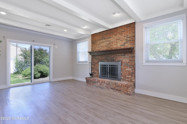 68 Elm St, Beachwood, NJ 08722 - unfurnished living room with beamed ceiling, baseboards, wood finished floors, and a brick fireplace