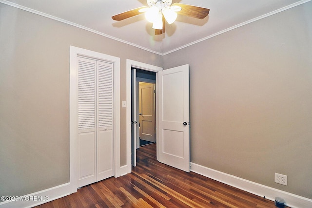 1600 Lawrence Ave, Toms River, NJ 08757 - unfurnished bedroom with dark wood-style floors, baseboards, a closet, crown molding, and ceiling fan