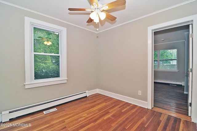 1600 Lawrence Ave, Toms River, NJ 08757 - unfurnished room with baseboard heating, wood finished floors, crown molding, a ceiling fan, and baseboards