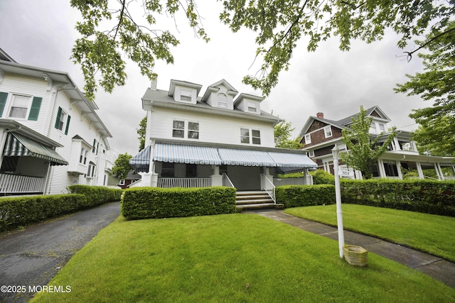 503 Page Ave, Allenhurst, NJ 07711 - view of front of home featuring a front lawn and a porch
