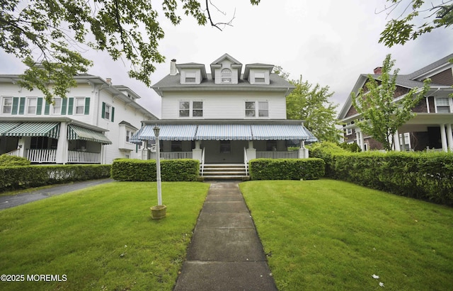 503 Page Ave, Allenhurst, NJ 07711 - traditional style home featuring covered porch and a front lawn