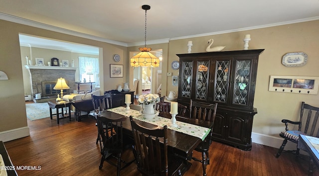 503 Page Ave, Allenhurst, NJ 07711 - dining room featuring dark wood-style flooring, ornamental molding, a fireplace, and a baseboard radiator