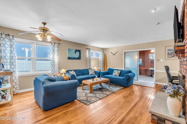 21 Clearwater Way, Toms River, NJ 08753 - living room with a ceiling fan, light wood finished floors, baseboards, and a fireplace