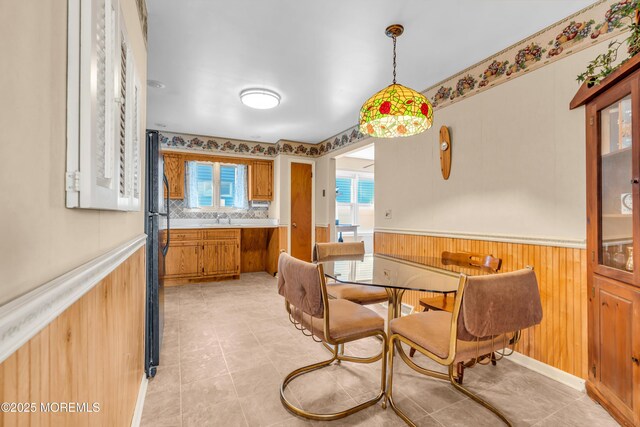 21 Clearwater Way, Toms River, NJ 08753 - dining area with a wainscoted wall, wood walls, and light tile patterned flooring