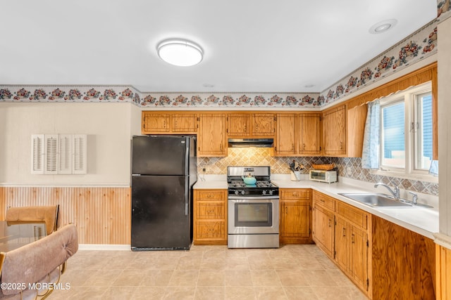 21 Clearwater Way, Toms River, NJ 08753 - kitchen with freestanding refrigerator, stainless steel gas range, a sink, under cabinet range hood, and light countertops